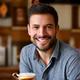 Portrait of James P., a coffee enthusiast, holding a coffee cup